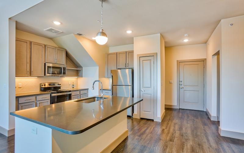 Spacious kitchens with thoughtful details a kitchen with a marble counter top island