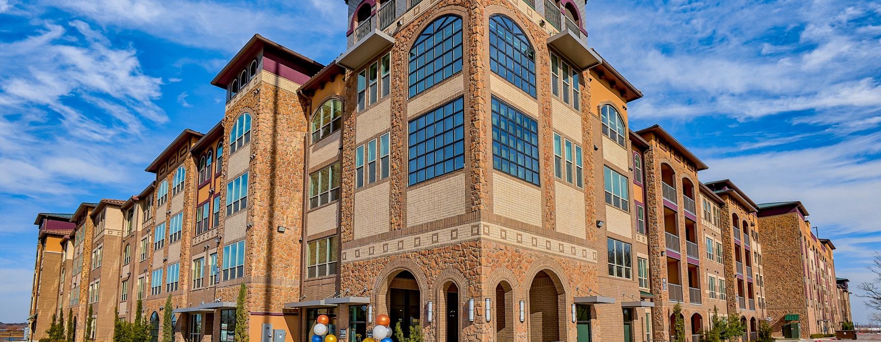 a large building with a road in front of it